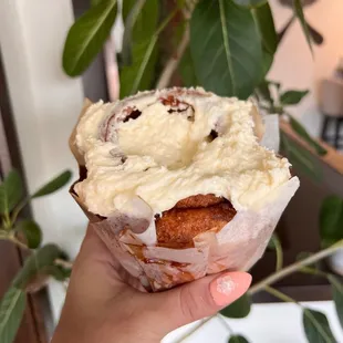 a hand holding a pastry