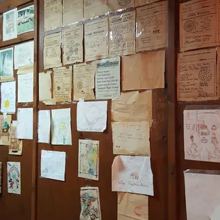 a wall covered with papers