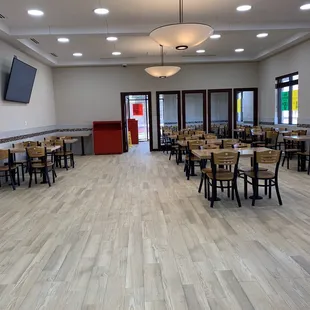 a restaurant with tables and chairs