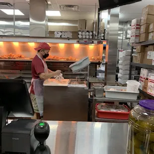 a woman working in a commercial kitchen