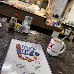 a menu and a cup of coffee