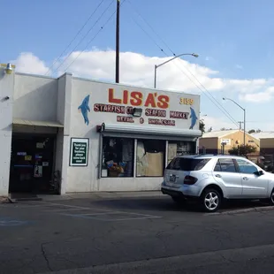a car parked in front of a restaurant