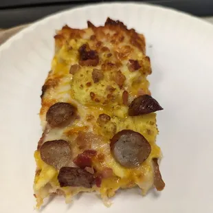 Breakfast pizza with eggs, cheese, sausage and bacon!