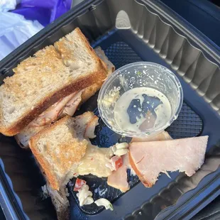 Half-eaten Ortega panini.