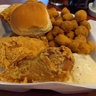 Fried chicken, fried okra, mashed potatoes with creamy gravy and roll.