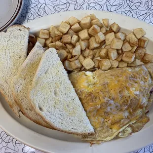 Ham &amp; cheese omelette, breakfast potatoes, sourdough toast