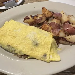 Egg omelette and potatoes and pancakes they were delicious and huge!