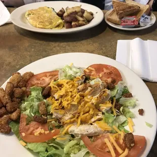Omelette and a grilled chicken salad