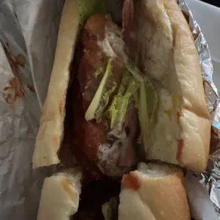 a sandwich with meat and lettuce