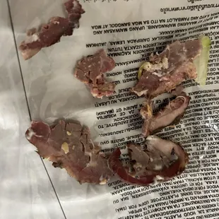 Pieces from the Roast Beef sandwich which were inedible!