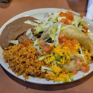Puffy Tacos with rice and refried beans