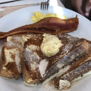a plate of pancakes and bacon