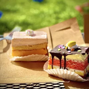 two pieces of cake on a table