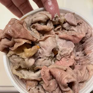 a person holding a bowl of food