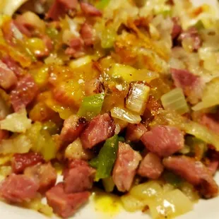 Up close of the perfect balance of the corn beef to potatoes.