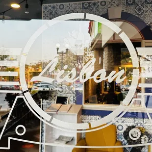 a yellow chair in the window