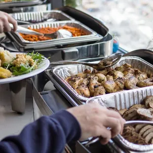 a buffet of food being served