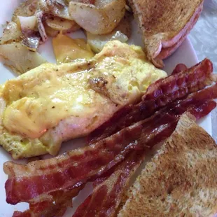 Scrambled with cheese, 3 slices of bacon, 2 slices of toast &amp; home fries for less than $6.00! And all cooked perfectly to order.