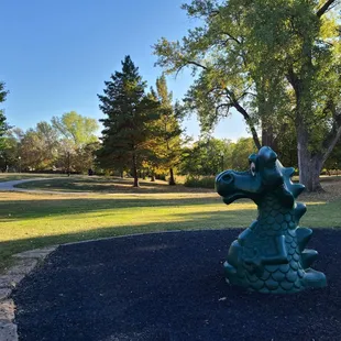 Paved walking trail next to the playground.