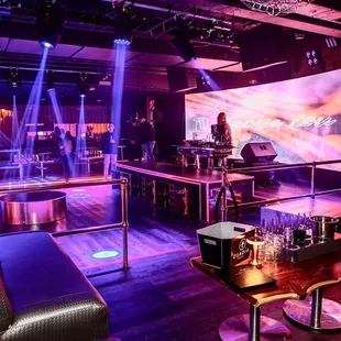 a bar with purple lighting