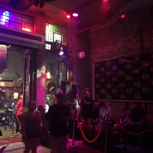 a group of people sitting outside a bar