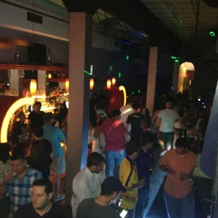 a large group of people at a bar