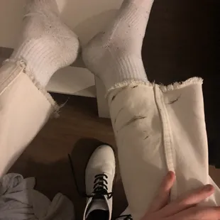the feet of a person wearing white socks