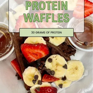 Chocolate protein waffles with strawberries, bananas, and chocolate chips.