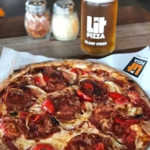 a pepperoni pizza and a beer