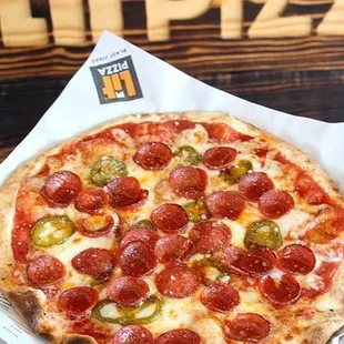 a pepperoni and jalapeno pizza