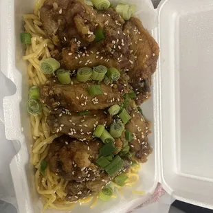 Korean chicken wings on garlic noodles.