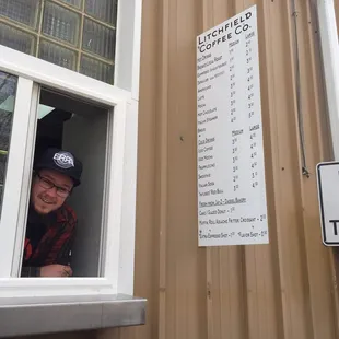 a man looking out of a window