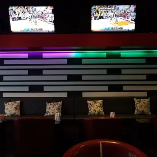 two televisions on the wall