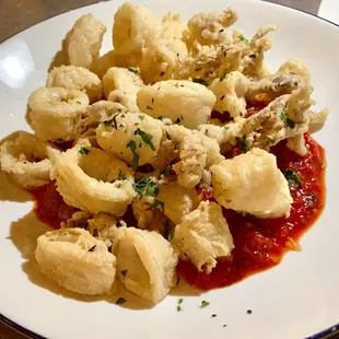 Calamari Frite with red peppers, garlic, greens and and charred tomato salsa