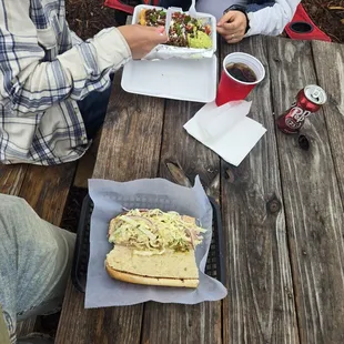 Messi- Named after Lionel Messi  (sandwich on bottom with curtido (coleslaw?) And Argentina shrimp, super bomb! )