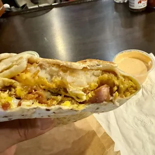 Inside of the wrap - lots of goodness in there w/ hash browns, bacon, eggs and more