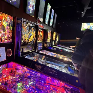 a row of pinball machines