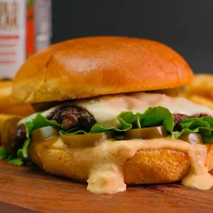 The Lost City: beef patty, pickled jalapeños, lettuce, blue cheese sauce, Angel's Secret sauce