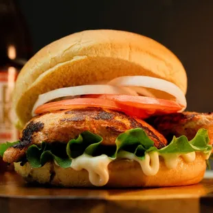 Halo Grilled Chicken Sandwich: Grilled chicken breast, lettuce, tomato and onion slices, and mayo