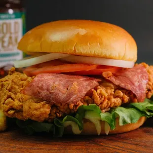 Angel Kiss Chicken Sandwich: golden-fried chicken breast, lettuce, onion, tomato, mayo, with turkey bacon