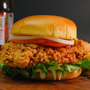 Angel's Favorite Chicken Sandwich: golden-fried crispy chicken breast, lettuce, onion and tomato, mayo