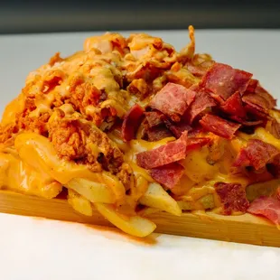 Turkey bacon or crispy chicken loaded fries: with cheddar cheese sauce and Angel's Secret sauce