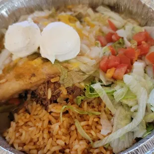 Stuffed sopapilla with shredded beef &amp; green chile.  I added sour cream at home.