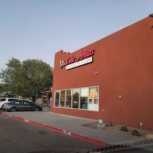 a car parked in front of the store