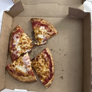 This is the $12 small pizza. Great size and presentation! Come on, do better. Don't gouge customers and provide a crappy product as well.