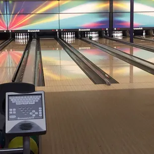 a laptop and bowling balls