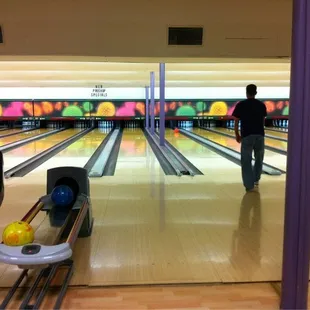 a bowling alley with bowling balls