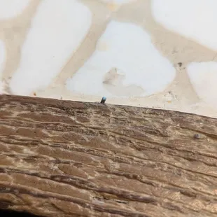 Nail in table