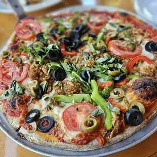 Napoletana pizza - sausage, peppers, olives, tomatoes, and basil