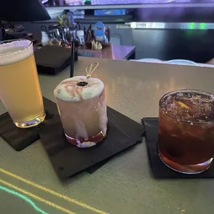 two cocktails and a drink